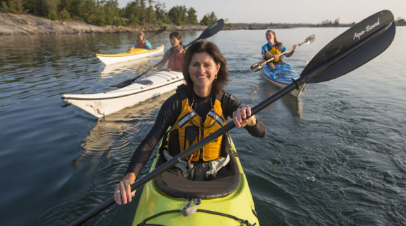 Group photo of women in sea kayaks.
