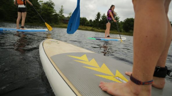 Women adults out on SUP boards at White Squall Paddling Centre